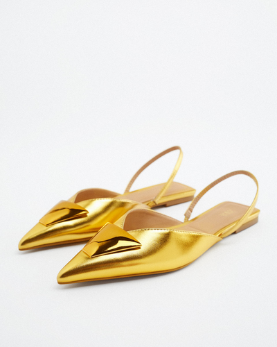 Flat metallic shoes with decoration 